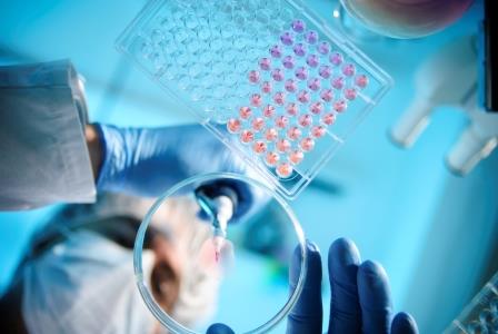 Scientist working in a lab with a pipette