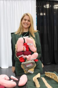 IMG_1769 res Project Manager Sarah Beard at SciMED wearing a vest with the body's internal organs