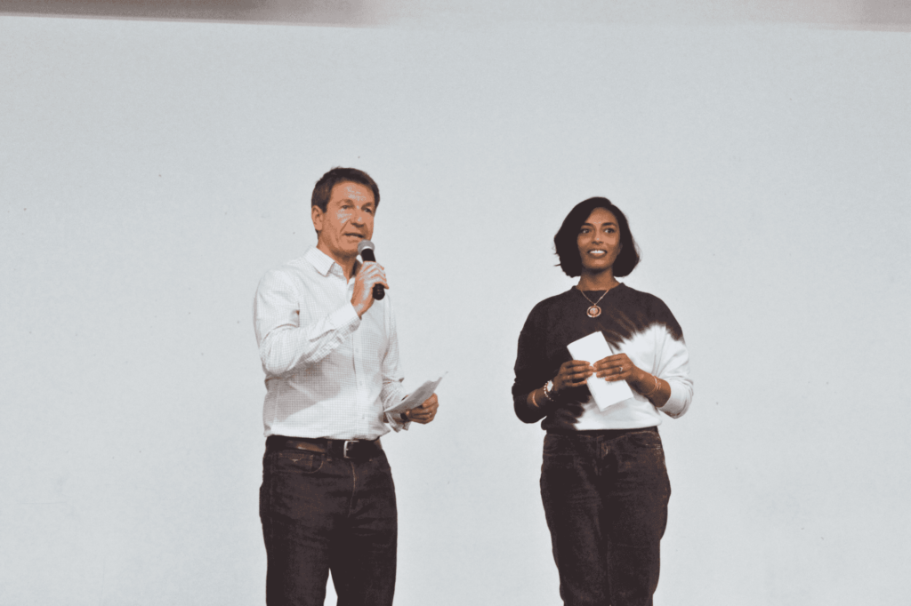 Untitled design (4) (1) (1) BRC director Professor Phil Newsome speaking on stage with Dr Ameeta Retzer