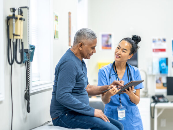 Healthcare professional discussing form with patient