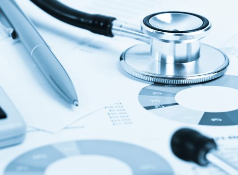 stethoscope and data charts