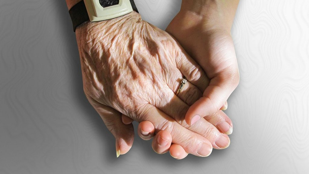sarco-thumb Young and elderly person with sarcopenia holding hands